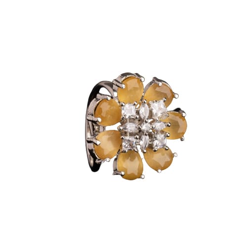 A YELLOW ZIRCON FINGER RING RADIATES VIBRANT, SUNNY BRILLIANCE WITH ITS WARM, GOLDEN HUE.