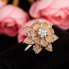 "Salmon zircon finger ring in silver offers a warm, radiant glow with a unique, rosy hue for party wear."
