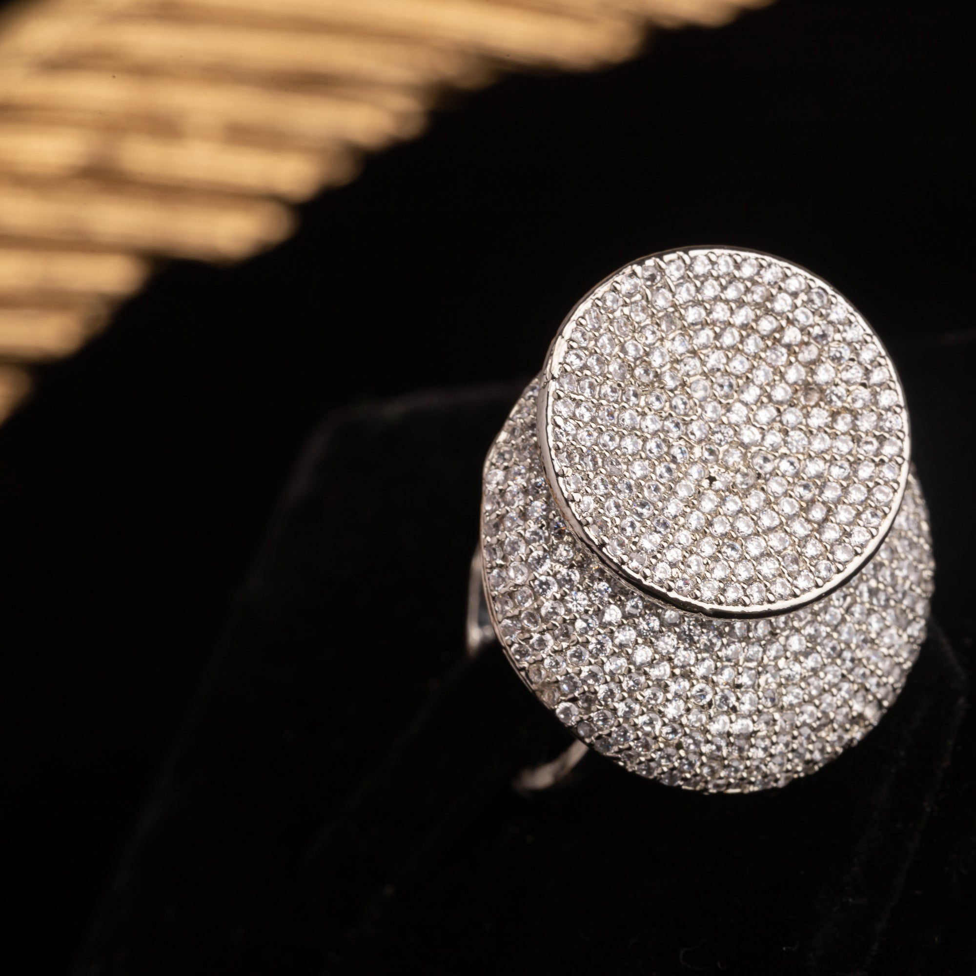 Stunning zircon ring in silver dazzles with vibrant, diamond-like sparkle for a chic party wear look."
