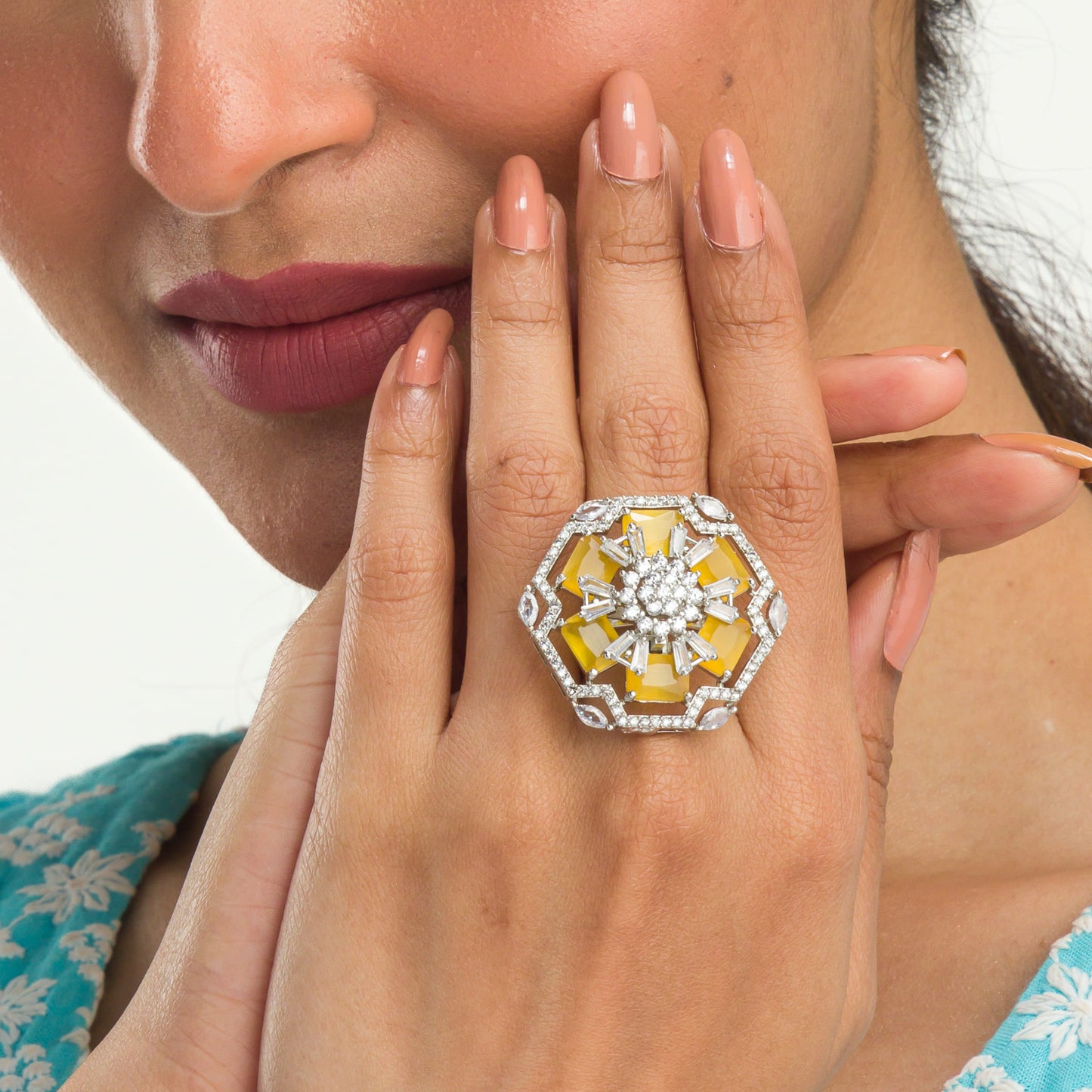 "YELLOW ZIRCON FINGER RING RADIATES VIBRANT, EYE-CATCHING BRILLIANCE."