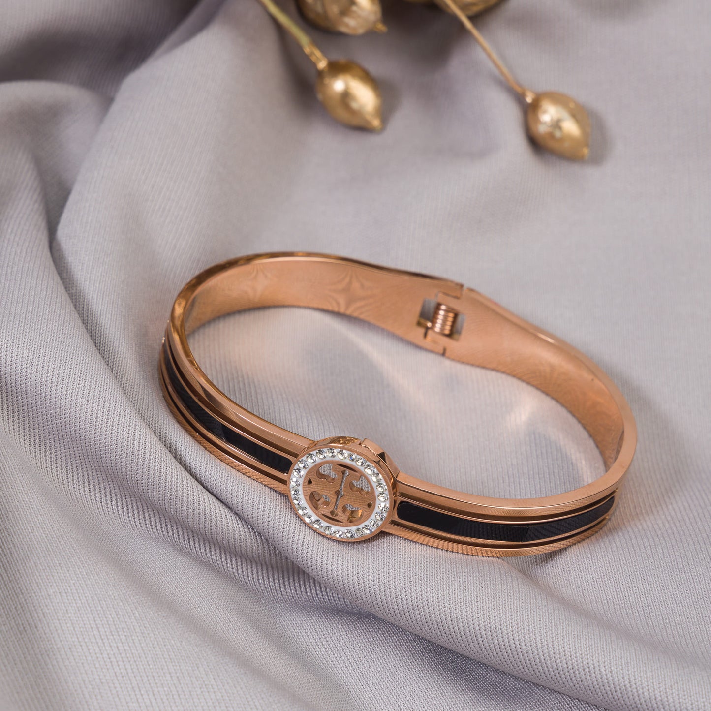 "A ZIRCON BRACELET WITH ROSE GOLD POLISH OFFERS A SOPHISTICATED BLEND OF SPARKLE AND WARMTH."