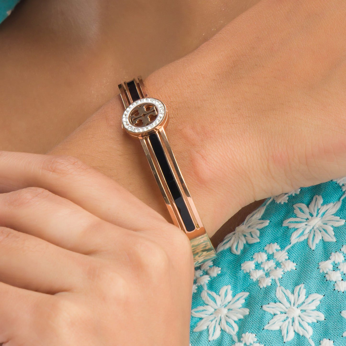 "A ZIRCON BRACELET WITH ROSE GOLD POLISH OFFERS A SOPHISTICATED BLEND OF SPARKLE AND WARMTH."