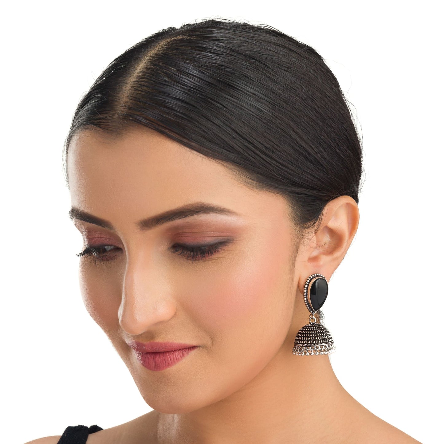 "OXIDIZED JHUMKA WITH A BLACK STONE AT THE CENTER DELIVERS A STRIKING, VINTAGE ALLURE."