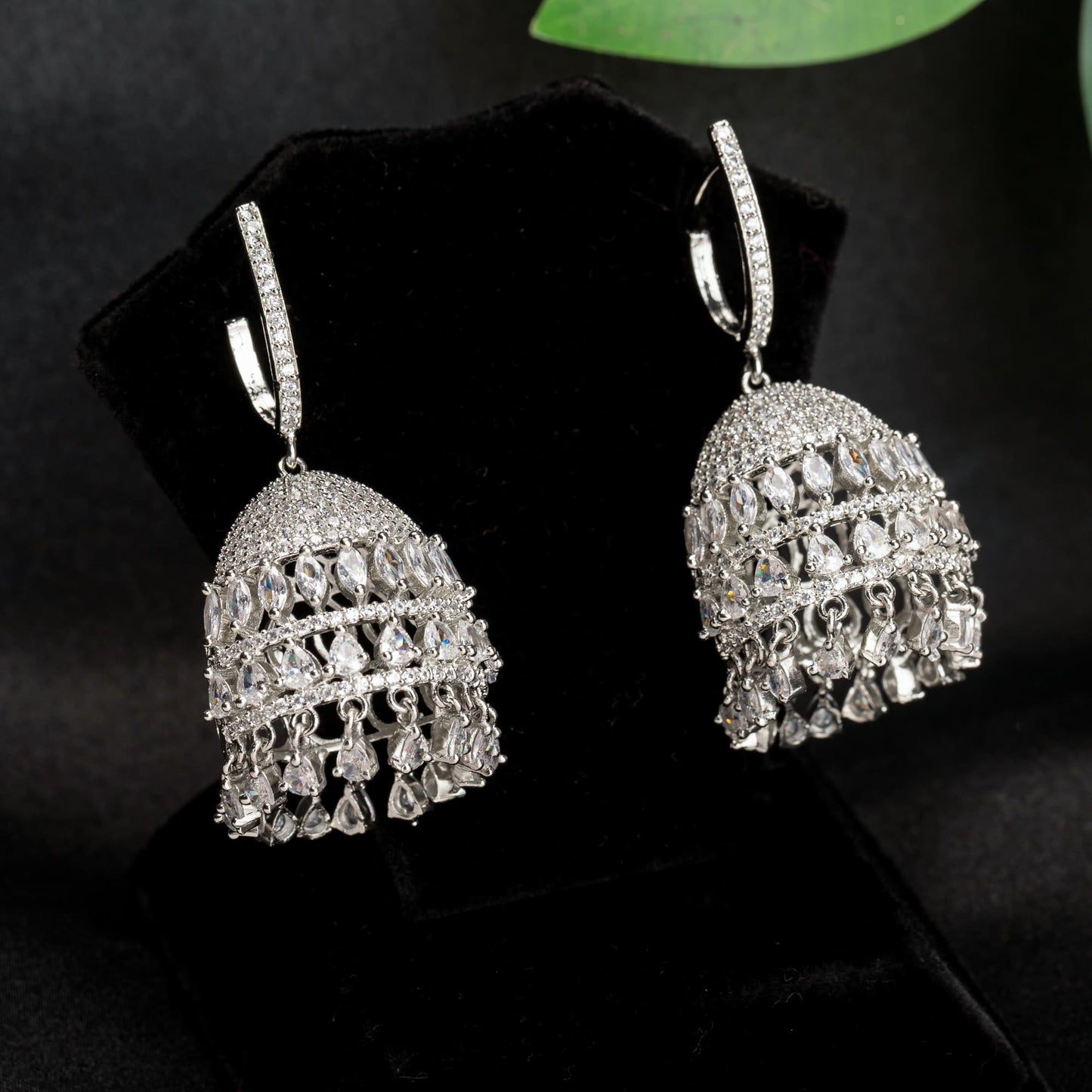 "ZIRCON JHUMKA COMBINES INTRICATE DETAILING WITH RADIANT SPARKLE FOR A STUNNING, TRADITIONAL TOUCH."