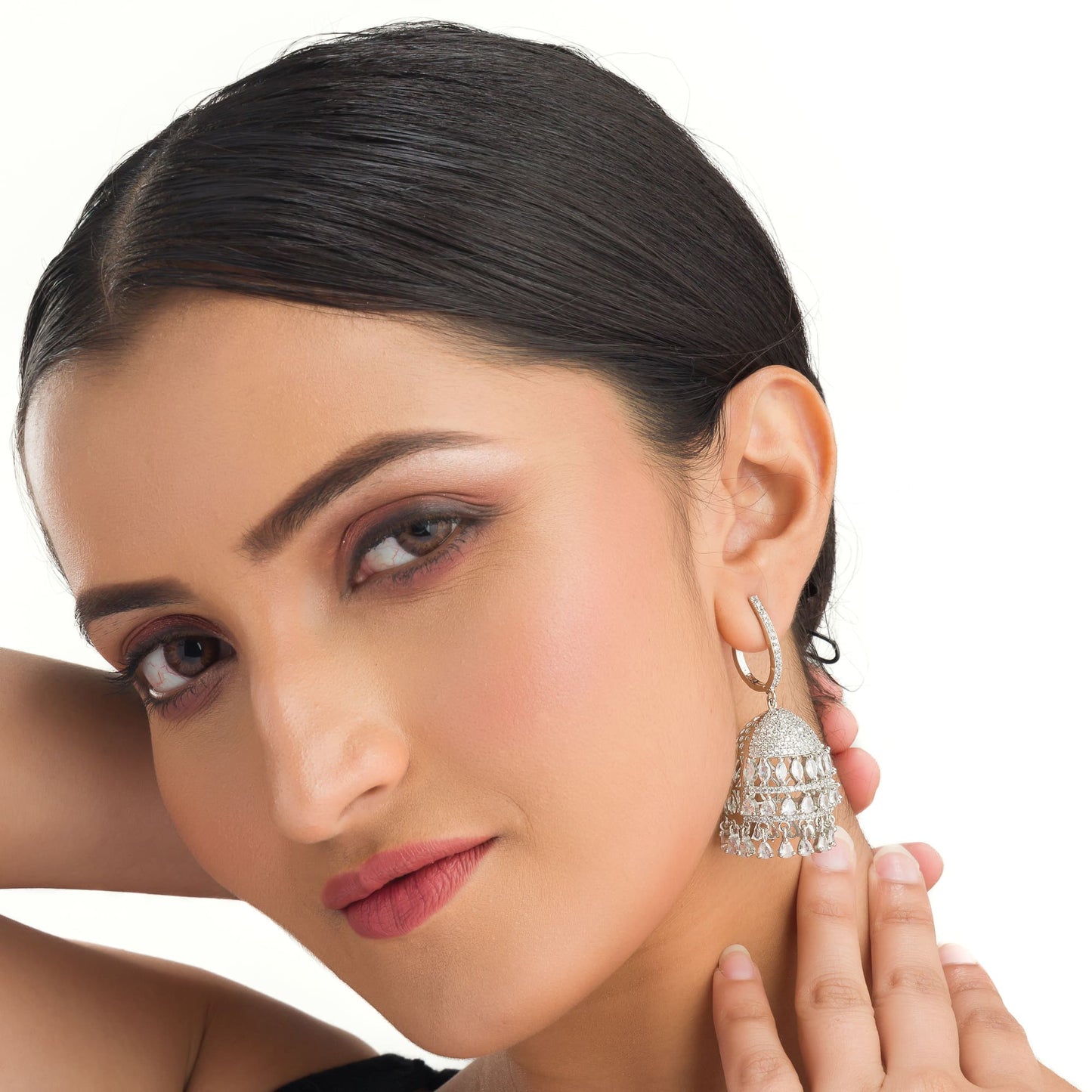 "ZIRCON JHUMKA COMBINES INTRICATE DETAILING WITH RADIANT SPARKLE FOR A STUNNING, TRADITIONAL TOUCH."