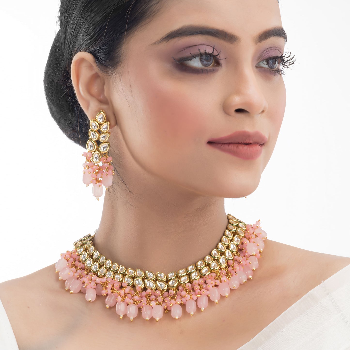 DOUBLE LAYER STUNNING KUNDAN BRIDAL SET WITH PINK PEARLS, INCLUDING MATCHING EARRINGS AND MAANGTIKA.