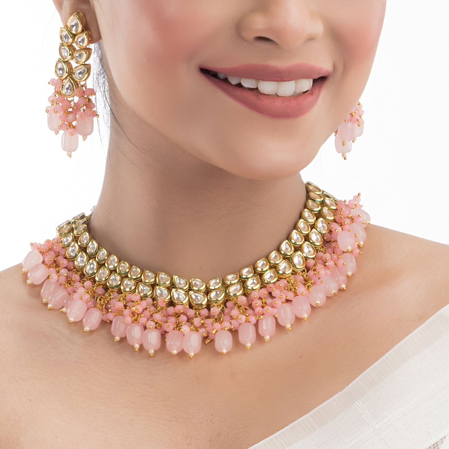 DOUBLE LAYER STUNNING KUNDAN BRIDAL SET WITH PINK PEARLS, INCLUDING MATCHING EARRINGS AND MAANGTIKA.