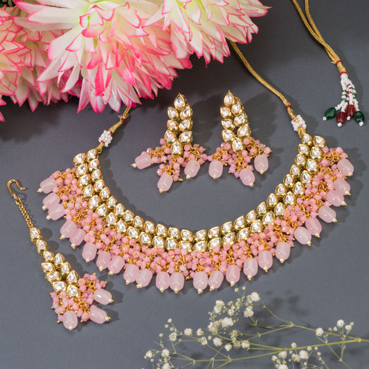 DOUBLE LAYER STUNNING KUNDAN BRIDAL SET WITH PINK PEARLS, INCLUDING MATCHING EARRINGS AND MAANGTIKA.