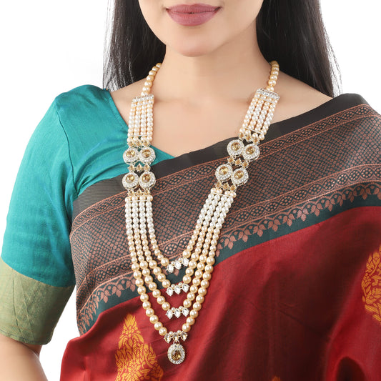 LONG NECKLACE SET FEATURING WHITE STONES STUDDED WITH PEARLS. ELEGENT AND BEST FOR ADDING A TOUCH OF SOPHISTICATION