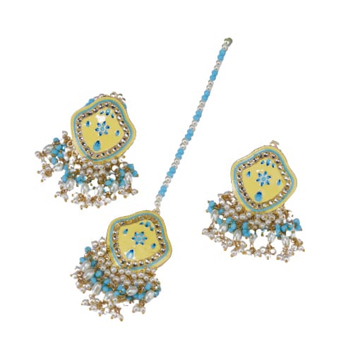 "WHEAT-COLORED EARRINGS AND MAANGTIKA, ADORNED WITH AQUA AND WHITE PEARL BEADS, OFFER A GRACEFUL BLEND OF SUBTLE ELEGANCE AND VIBRANT CHARM."