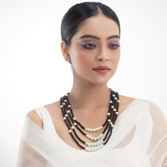 ELEVATE YOUR ELEGANCE WITH THIS BLACK AND WHITE PEARLS STUDDED LONG NECKLACE SET.