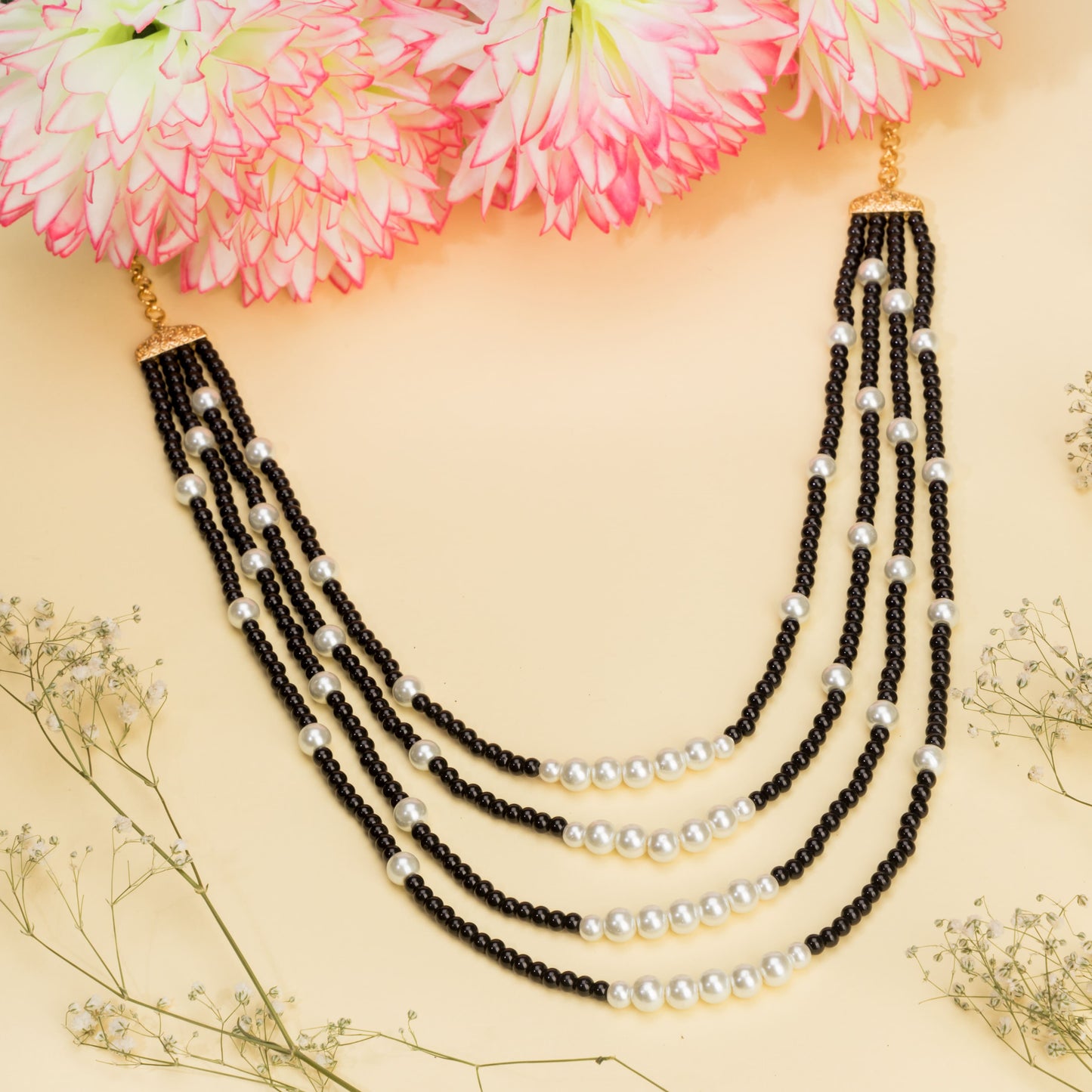 ELEVATE YOUR ELEGANCE WITH THIS BLACK AND WHITE PEARLS STUDDED LONG NECKLACE SET.