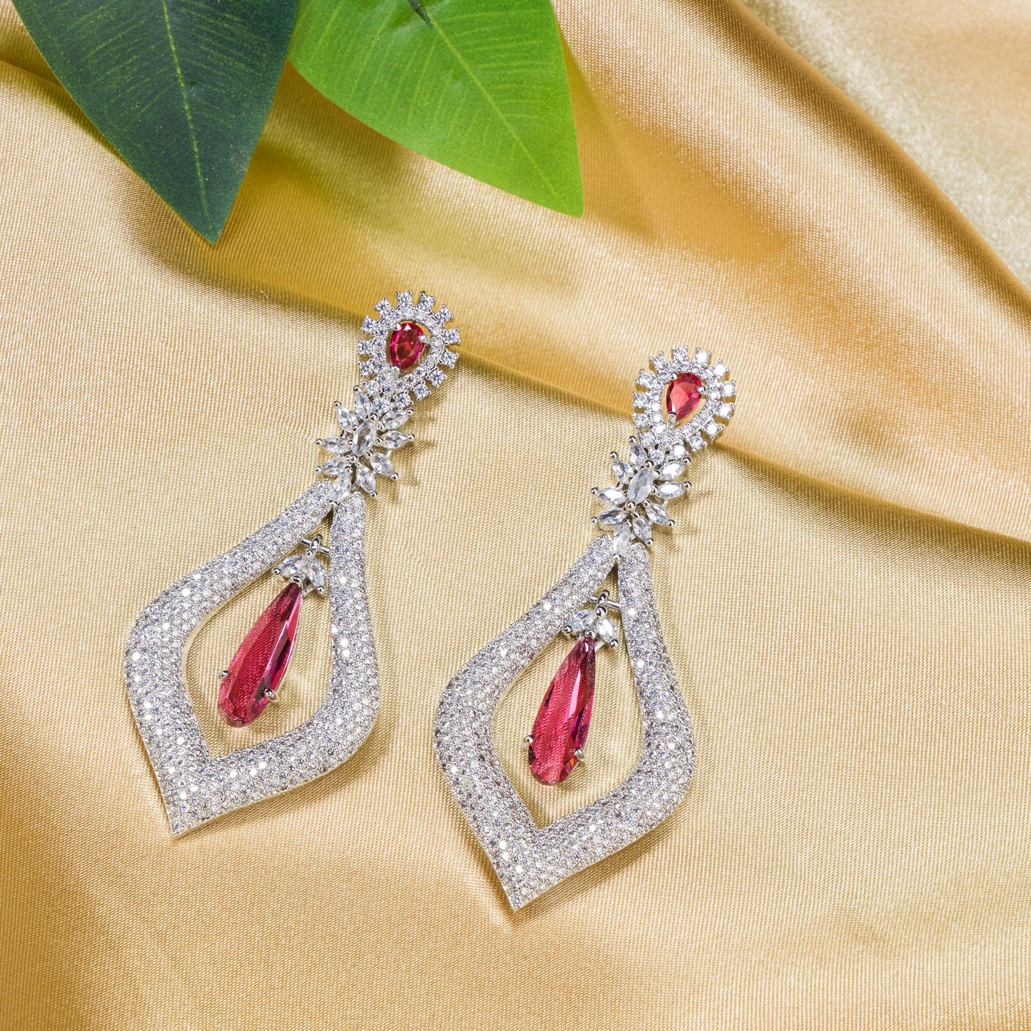 WHITE AND RED ZIRCON TOGETHER CREATE A STRIKING CONTRAST OF SPARKLE AND BOLD COLOR."