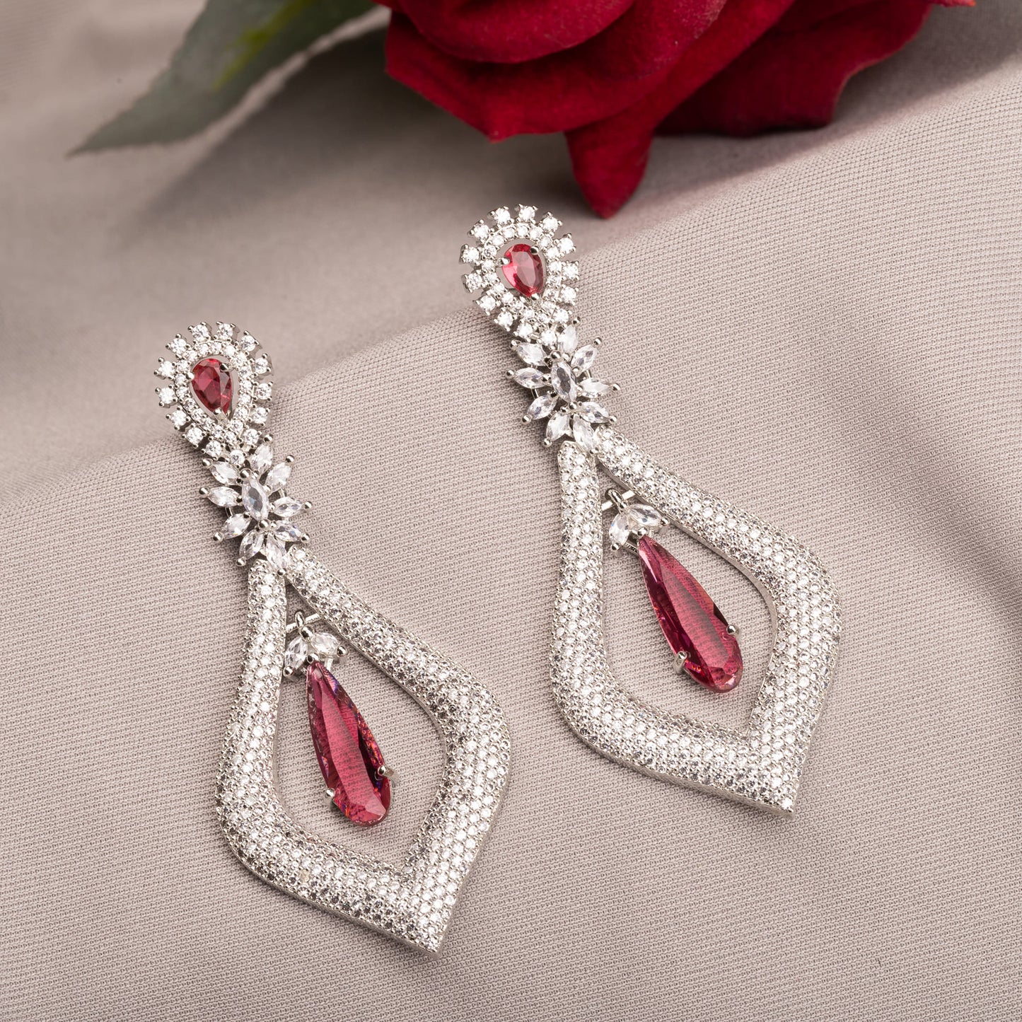 WHITE AND RED ZIRCON TOGETHER CREATE A STRIKING CONTRAST OF SPARKLE AND BOLD COLOR."