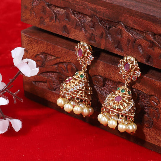 ADD A CLASSIC TOUCH WITH THESE GOLDTONE JHUMKA EARRINGS. FEATURING INTRICATE DETAILING AND A RICH GOLDTONE FINISH,