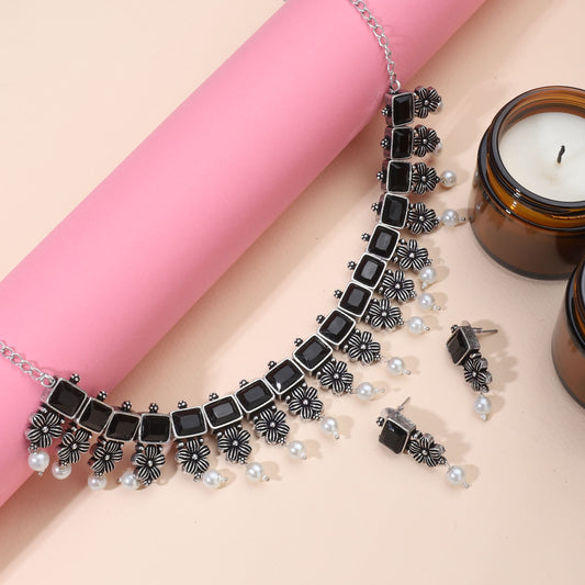 STYLISH OXIDIZED NECKLACE SET FEATURING FLORAL DESIGN WITH BLACK STONES, ADDING A BOLD  TOUCH.