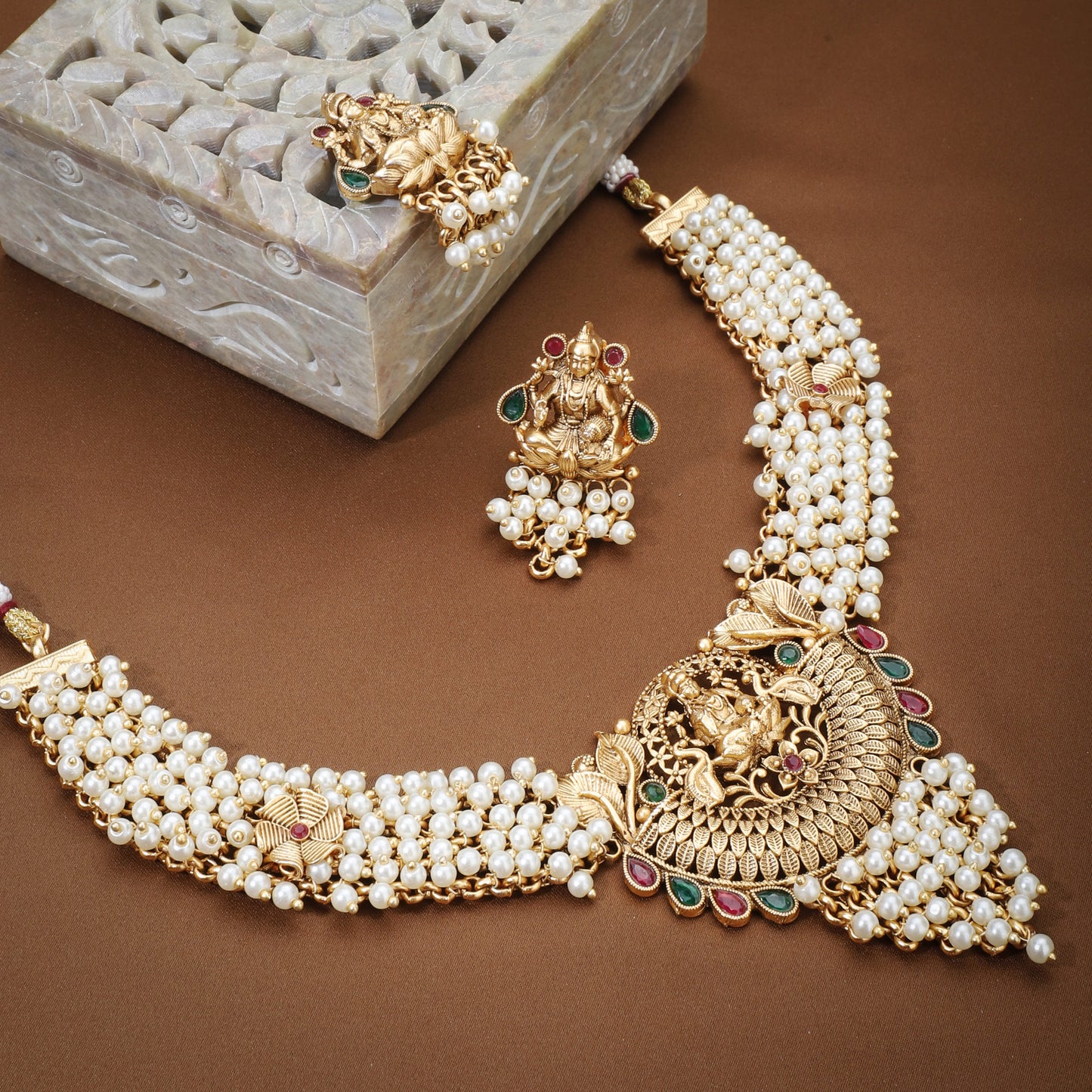 THE LAXMI MAA CRAFTED GOLD-TONE NECKLACE SET WITH WHITE PEARLS COMBINES DIVINE CRAFTSMANSHIP WITH ELEGANT DESIGN.