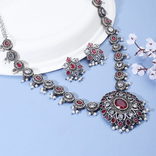 PINK STONE-STUDDED OXIDIZED LONG NECKLACE SET WITH MATCHING EARRINGS.