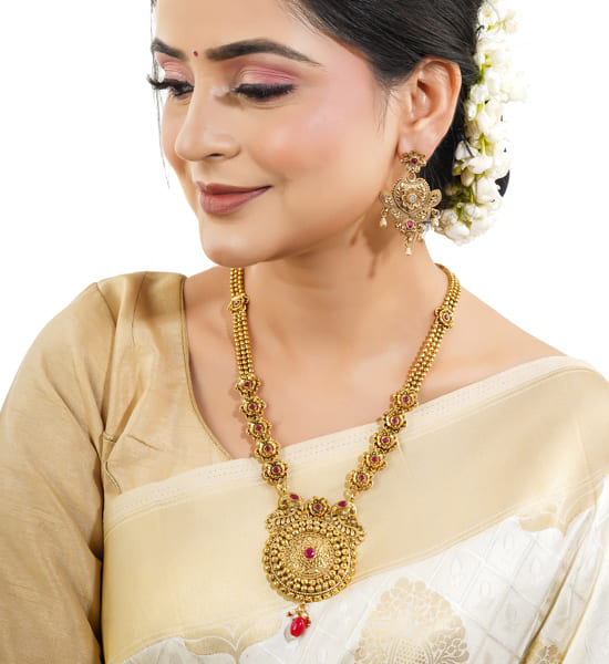 GOLD-TONE LONG NECKLACE SET WITH INTRICATE DETAILINGS WITH MATCHING EARRINGS