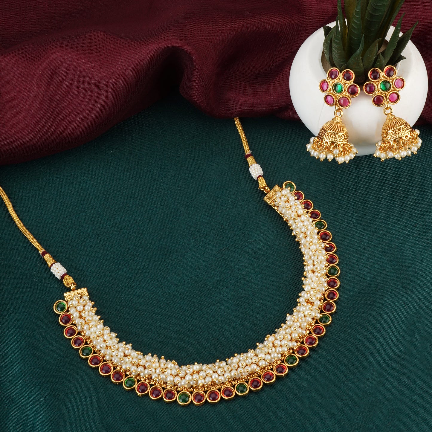 ELEVATE YOUR STYLE WITH THIS PEARLS STUDDED GOLDTONE CHOKER SET