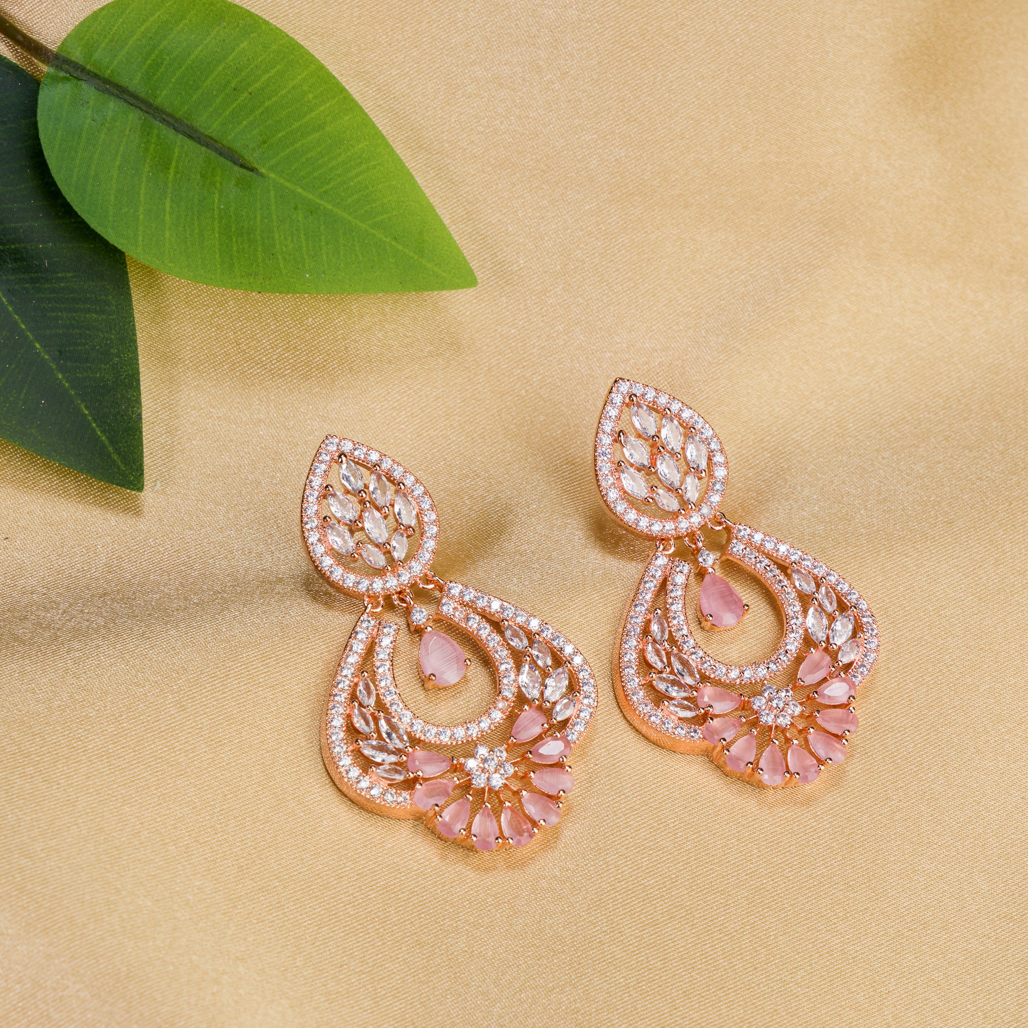 "Orchid zircon earrings with rose gold polish exude romantic elegance and a lush glow."
