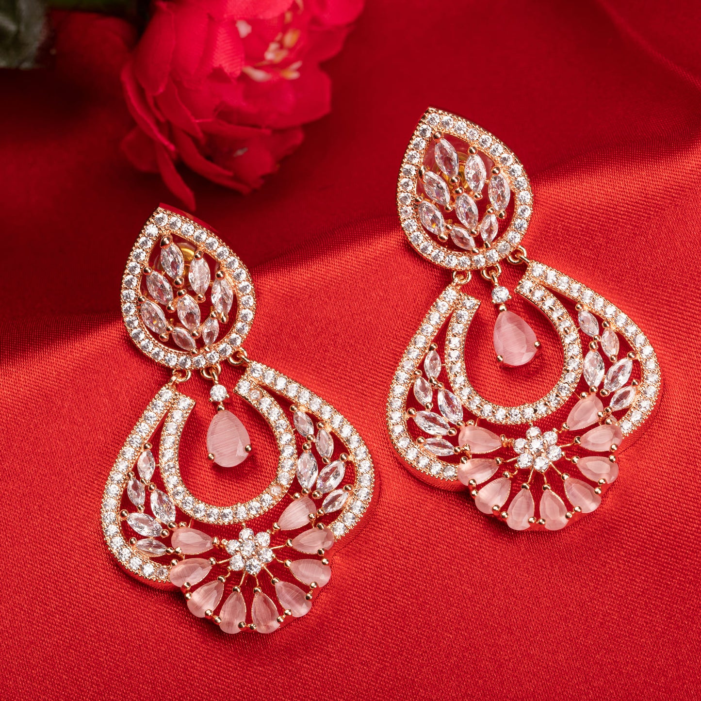 ZIRCON EARRINGS WITH ORCHID ZIRCON ON ROSE GOLD POLISH EXUDES A LUSH, ROMANTIC GLOW WITH REFINED ELEGANCE