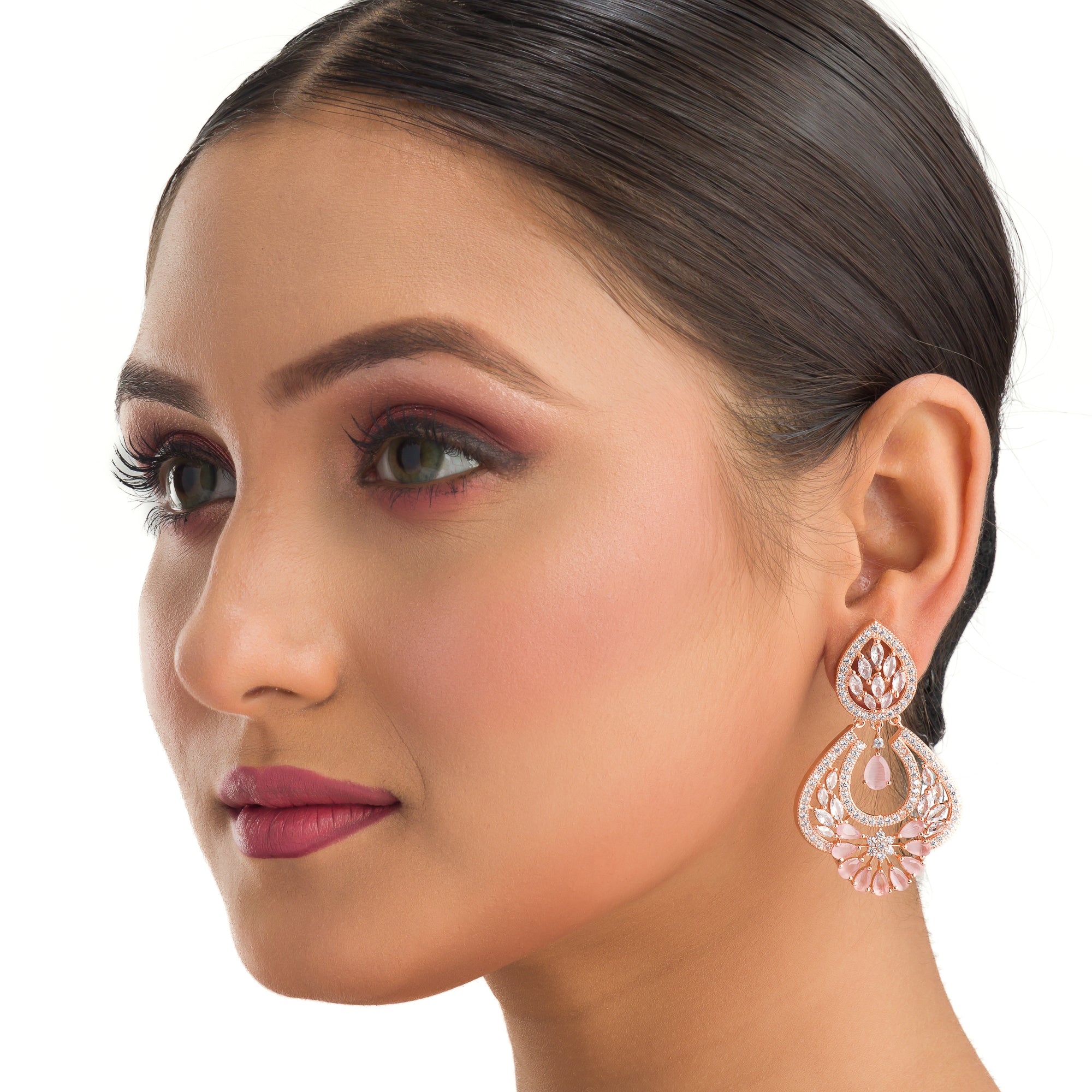 "Orchid zircon earrings with rose gold polish exude romantic elegance and a lush glow."
