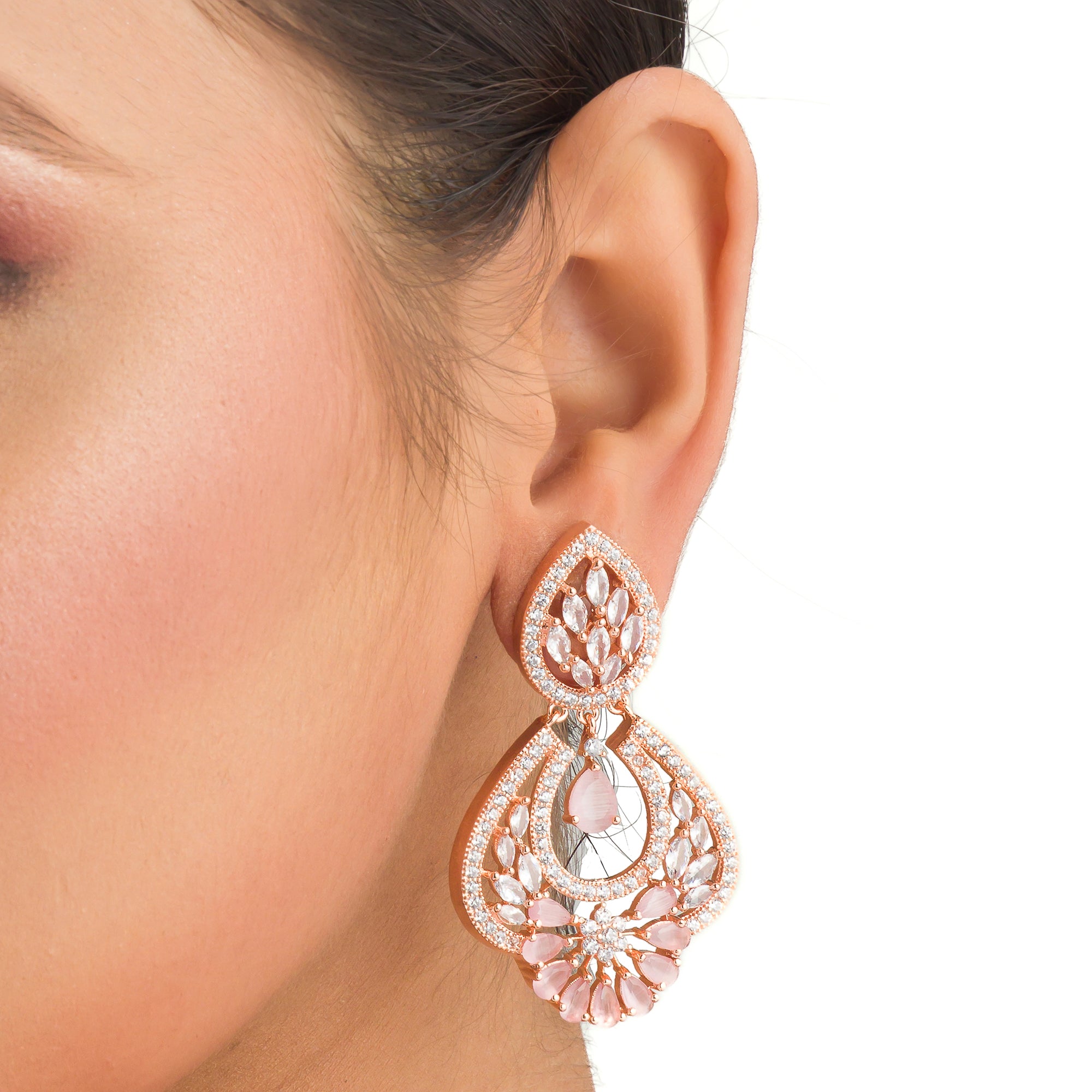 "Orchid zircon earrings with rose gold polish exude romantic elegance and a lush glow."
