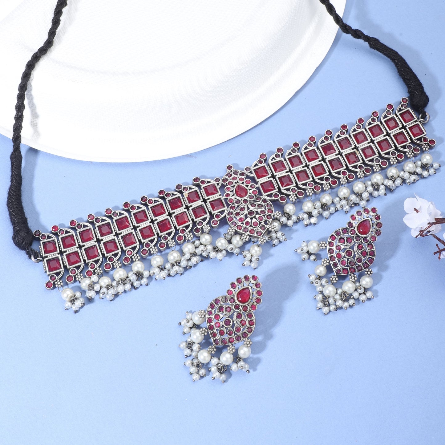 PINK STONE-STUDDED OXIDIZED CHOKER SET WITH MATCHING EARRINGS.