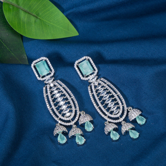 "TURQUOISE COLOURED ZIRCON  EARRINGS OFFER A STUNNING POP OF VIBRANT, OCEANIC COLOR AND ELEGANCE."