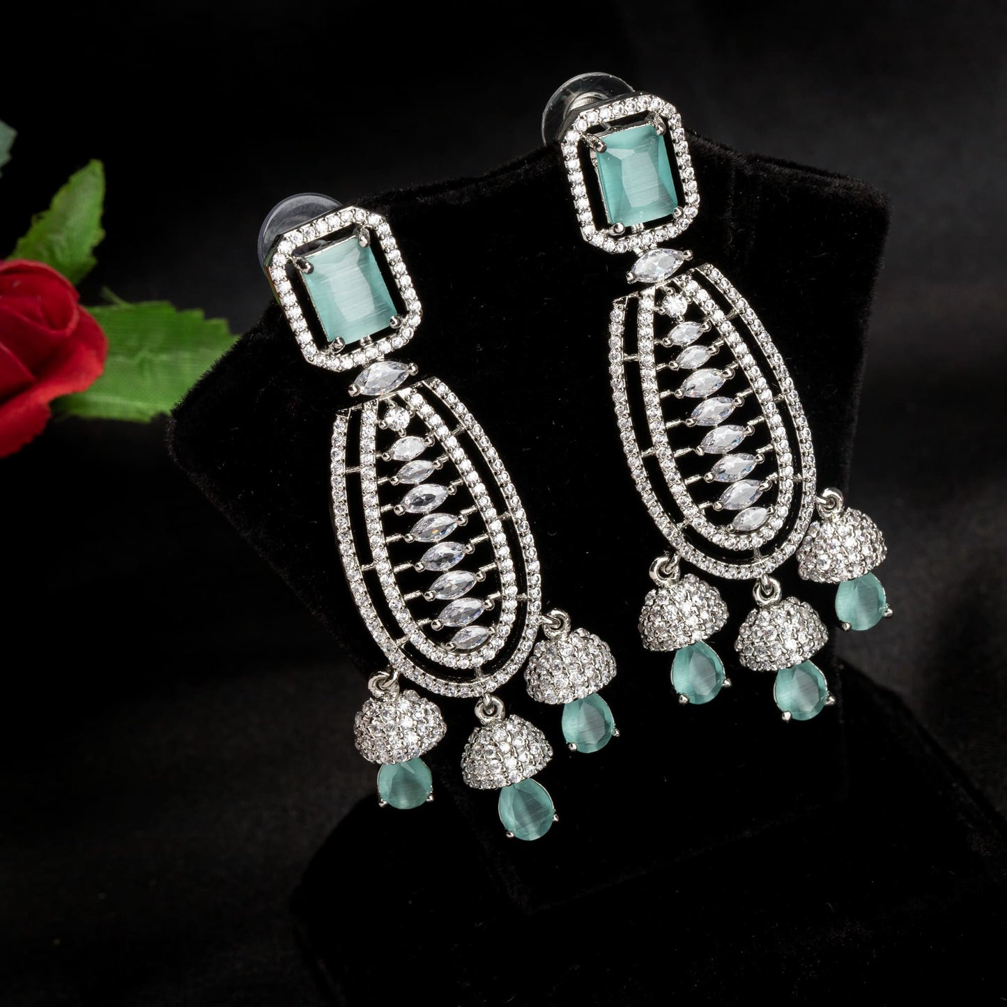 "TURQUOISE COLOURED ZIRCON  EARRINGS OFFER A STUNNING POP OF VIBRANT, OCEANIC COLOR AND ELEGANCE."