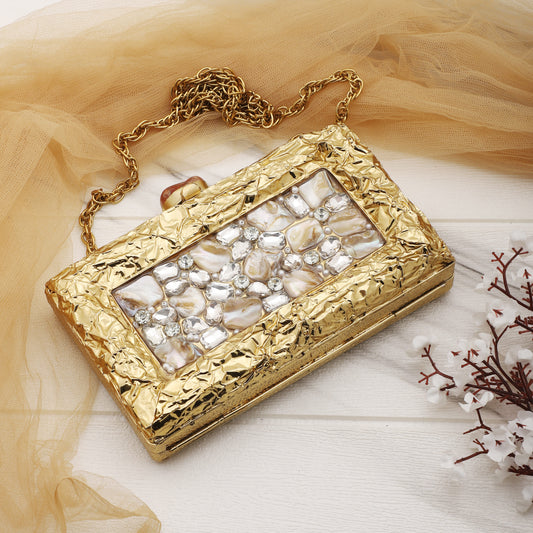 ADD A TOUCH OF LUXURY WITH THIS DESIGNER BRASS MOP CLUTCH, ADORNED WITH SPARKLING ZIRCON STONES.