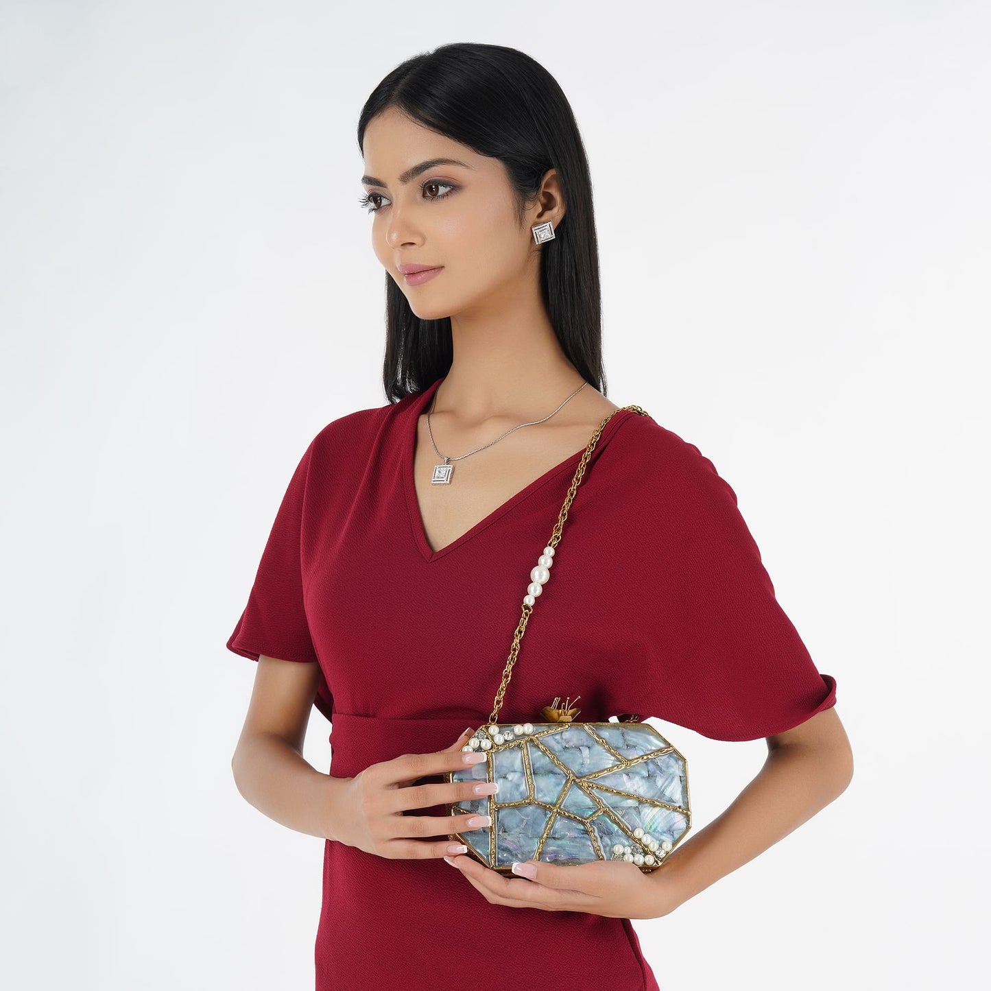 "ELEVATE YOUR STYLE WITH THIS DESIGNER HEXAGONAL-SHAPED MOP CLUTCH.