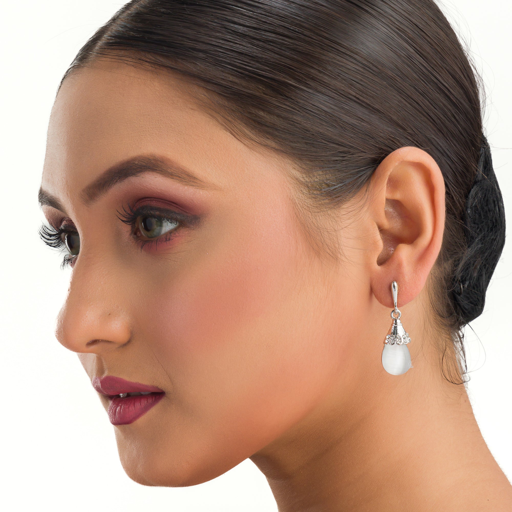 "Azure zircon hoop earring adds a bold splash of vibrant, captivating color for a chic look."
