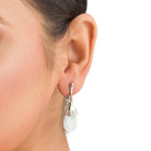 "Azure zircon hoop earring adds a bold splash of vibrant, captivating color for a chic look."
