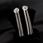 "Trendy zircon and stainless steel long earrings combine modern chic with sparkling elegance."
