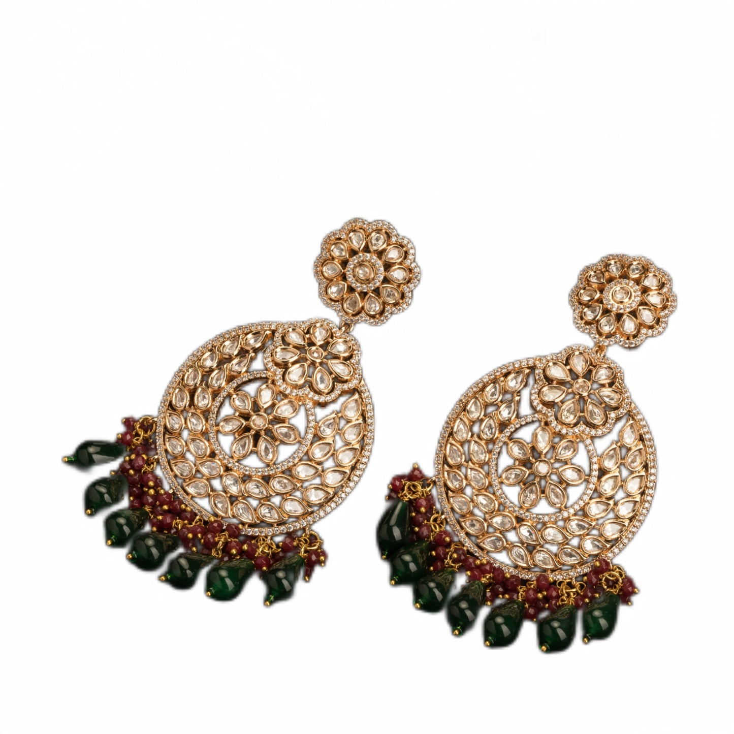 "INTRICATELY DESIGNED KUNDAN EARRINGS RADIATE TIMELESS ELEGANCE AND REGAL CHARM."