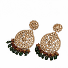 1. "Intricately designed kundan earrings radiate timeless elegance and regal charm."
