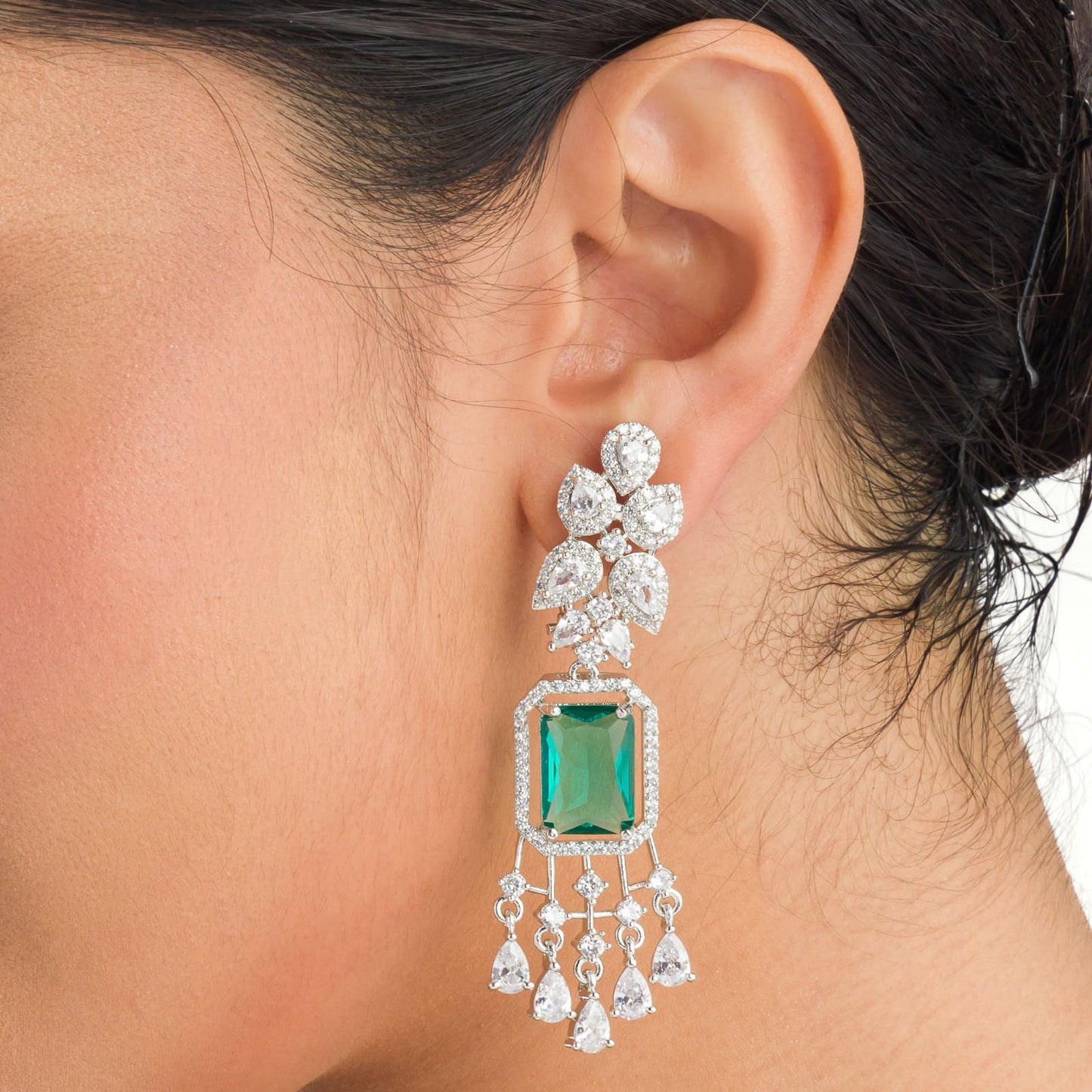 "GRACEFUL GREEN LONG ZIRCON EARRINGS SHIMMER WITH TIMELESS ELEGANCE AND SOPHISTICATION."