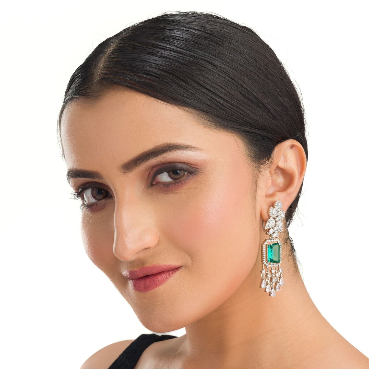 "GRACEFUL GREEN LONG ZIRCON EARRINGS SHIMMER WITH TIMELESS ELEGANCE AND SOPHISTICATION."