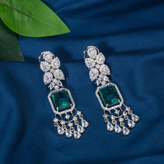 "GRACEFUL GREEN LONG ZIRCON EARRINGS SHIMMER WITH TIMELESS ELEGANCE AND SOPHISTICATION."