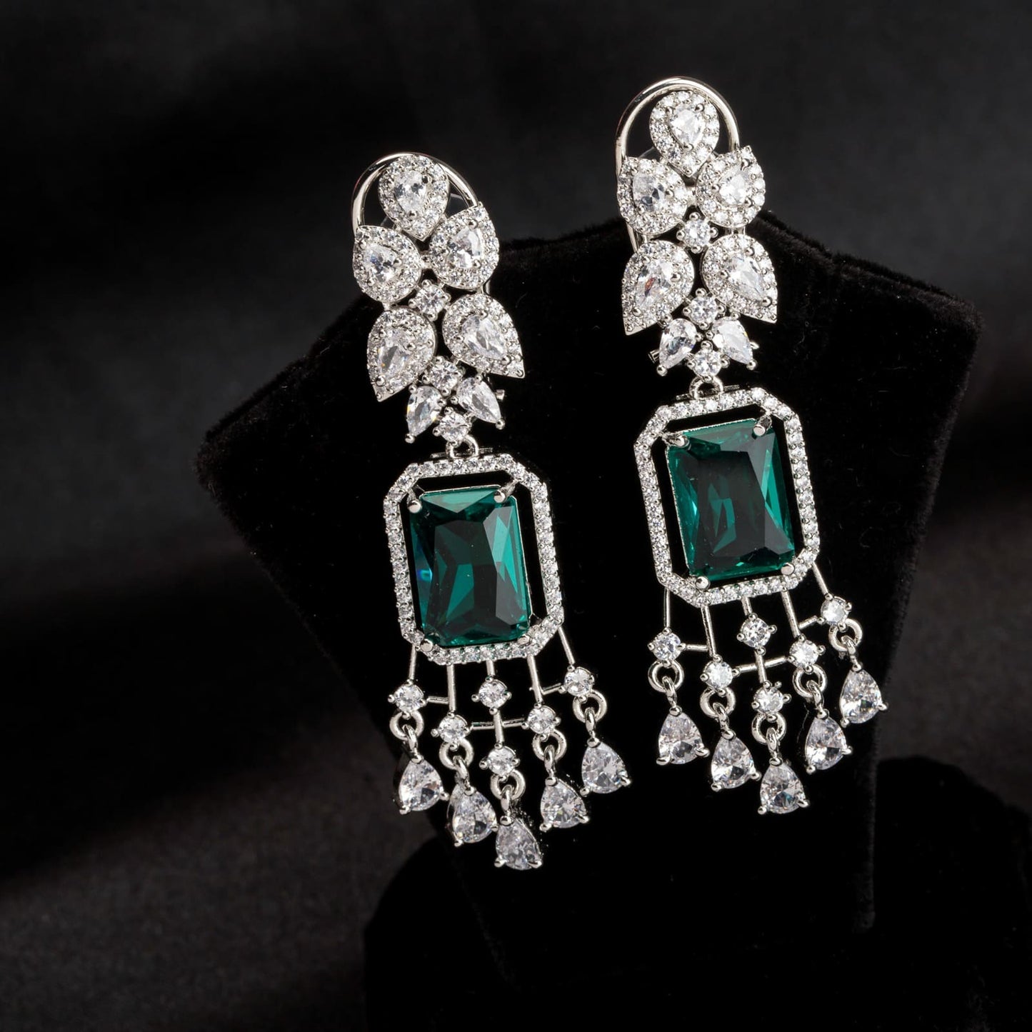 "GRACEFUL GREEN LONG ZIRCON EARRINGS SHIMMER WITH TIMELESS ELEGANCE AND SOPHISTICATION."