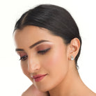 "Elegant peacock-shaped zircon studs add whimsical beauty and sparkle to your look."
