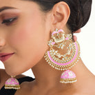 "Oversized pink jhumka with intricate detailing adds a bold, elegant touch to any outfit."
