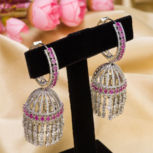 A PINK BIG JHUMKA FEATURES VIBRANT, OVERSIZED DESIGN WITH INTRICATE DETAILING, ADDING A BOLD AND ELEGANT TOUCH TO ANY OUTFIT.