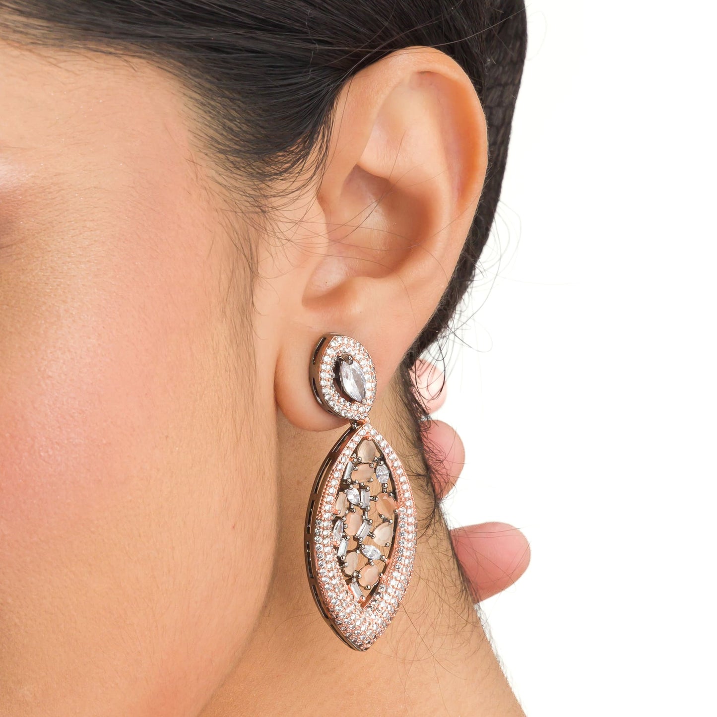 "ROSE GOLD EARRINGS WITH SALMON ZIRCON EXUDE A WARM, RADIANT CHARM THAT'S BOTH SOPHISTICATED AND ENCHANTING."