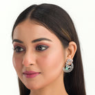 "Stunning turquoise zircon earrings add a touch of elegance and sparkle to any outfit."
