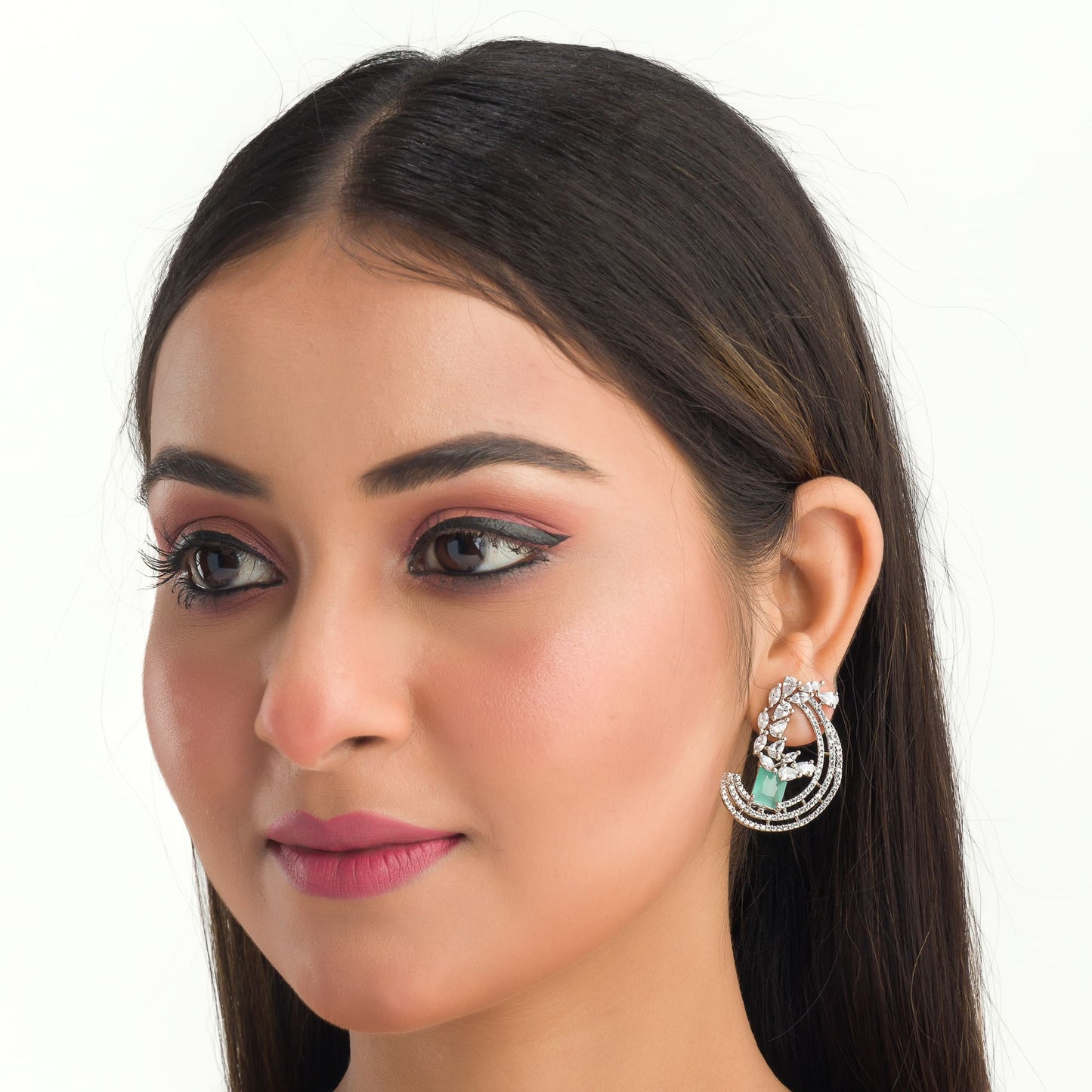 "STUNNING ZIRCON EARRINGS WITH A CAPTIVATING TURQUOISE  HUE ADD A TOUCH OF ELEGANCE AND SPARKLE TO ANY OUTFIT."