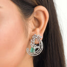 "Stunning turquoise zircon earrings add a touch of elegance and sparkle to any outfit."
