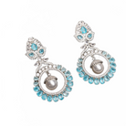 "Aqua zircon earrings with a captivating hue bring elegance and sparkle to your look."
